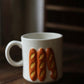 M03 Concombre Bakery Bread Mug